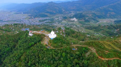 Flight over buddhist stupa aerial 4k video. Pokhara Valley Phewa lake Nepal Stock Footage 64825800