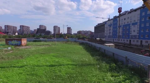 Flight over buildings under construction in Krasnodar 動画素材 58911946