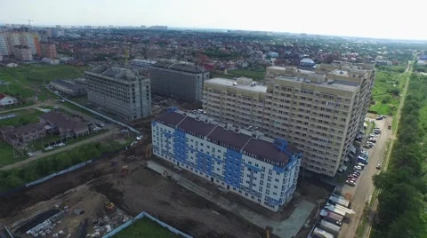 Flight over buildings under construction in Krasnodar Stock Footage 58912197