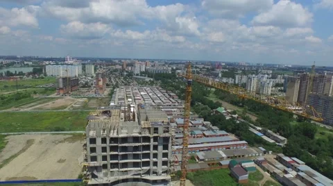 Flight over buildings under construction in Krasnodar Stock-Footage 58915689