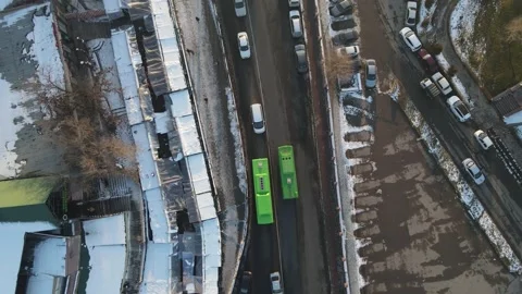 Flight over buses. Shooting buses from above. Buses and people. Winter Stock Footage 207447456