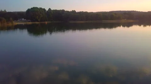 Flight over calm lake at evening. AERIAL landscape. Stock Footage 250183997