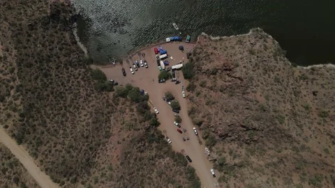 Flight Over Camp Site at River with Mountains in Arizona Video stock 157990279