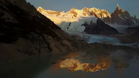 Flight over Cerro Torre mountain and Laguna Torre at sunrise. Patagonia Vidéo 82027512