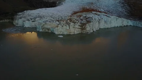 Flight over Cerro Torre mountain and Laguna Torre at sunrise. Patagonia Stock Footage 82031075