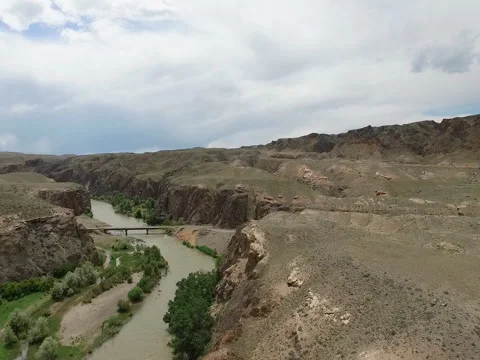 Flight over the Charyn River, Kazakhstan. Bridge over river. Stock Footage 77984332