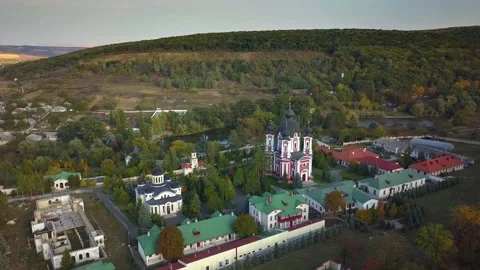 Flight over a christian monastery surrounded by autumn forest. Kurky monastery Stock Footage 136647686