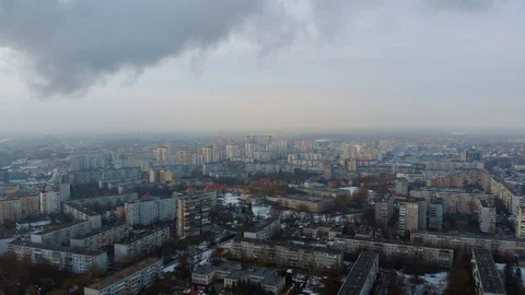 Flight over the city block and smoke coming out of a red-white pipe Stock Footage