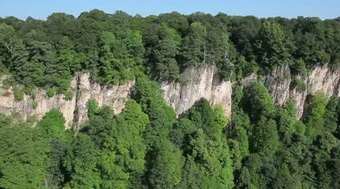 Flight over the cliffs to the forest Video stock 10595120