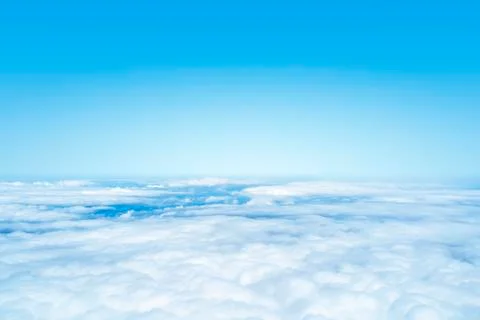 Flight over the clouds background Stock Photos