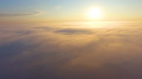 Flight over the clouds at dawn. Stock Footage 92691688