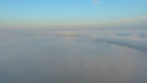 Flight over the clouds at dawn. Stock Footage 92692375