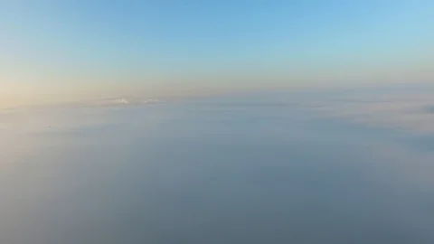 Flight over the clouds at dawn. Stock Footage 92693559