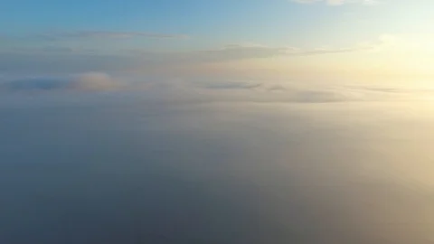 Flight over the clouds at dawn. Stock Footage 92695967