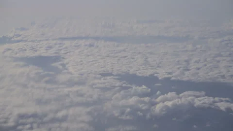 Flight over clouds, seen from an airplane window Video stock 302073628