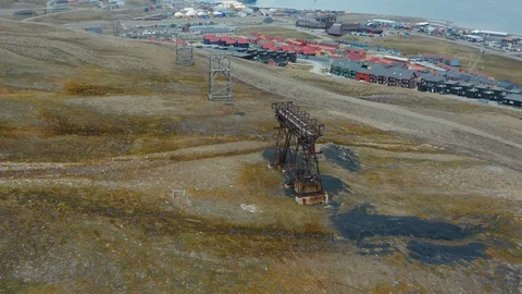Flight over the coal mining industry in Svalbard Stock Footage 127900651