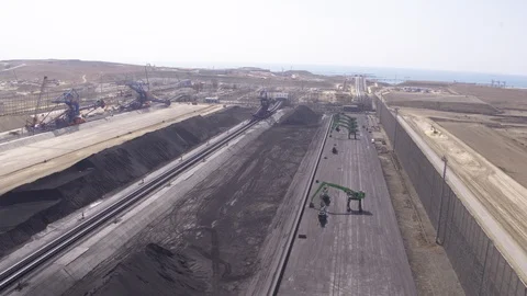 Flight over the coal storage and stacker reclaimers Stock-Footage 123699208