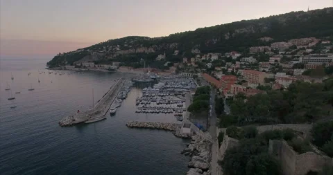 Flight over the coast of Nice at sunset. Mairie de Villefranche-sur-Mer Stock Footage 160010890