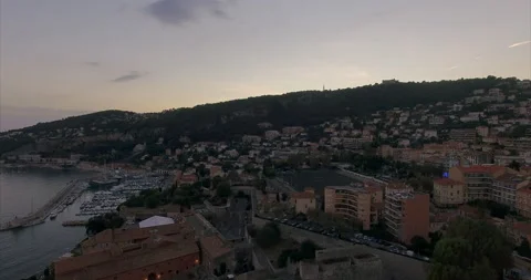 Flight over the coast of Nice at sunset. Mairie de Villefranche-sur-Mer Stock Footage 160010953