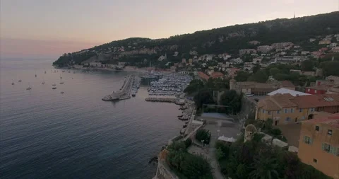 Flight over the coast of Nice at sunset. Mairie de Villefranche-sur-Mer Stock Footage 160011059