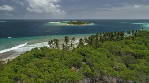 Flight over the coast of a small island. Flight around the rocky cape. Waves  Stock Footage 160440396