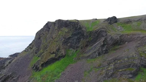 Flight over the coastal rocks and the coast of the Barents Sea, Russia. Stock Footage 83690752