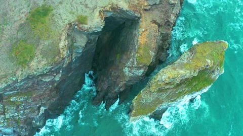 Flight over coastal rocks and raging sea. Stock Footage 143042017