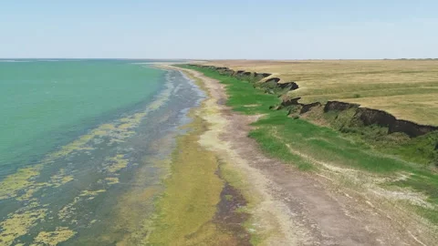 Flight over the coastline of a small pond Video stock 153028116