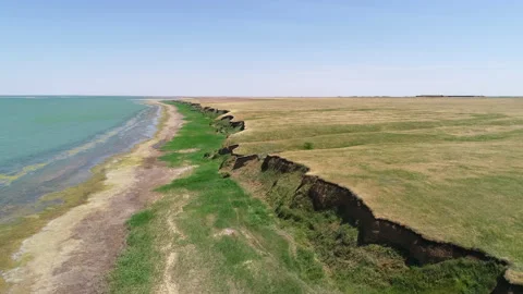 Flight over the coastline on a sunny summer day Stock Footage 153471754
