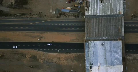 Flight over the construction of the interchange bridge on the highway on which Stock Footage 130850352
