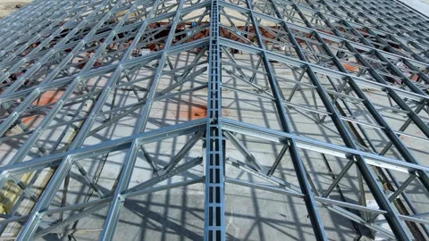 Flight over construction of a large metal structure in an agricultural area Stock Footage 306300636