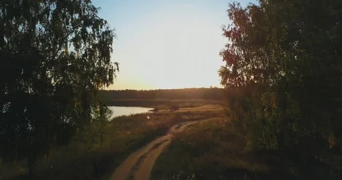 Flight over the counry road to the sunset Stock Footage 95216840