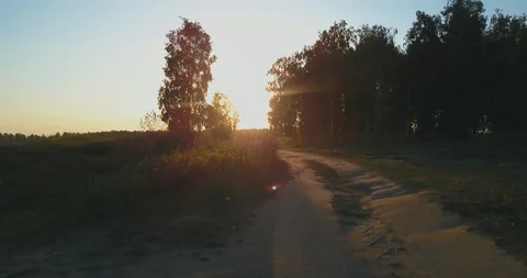 Flight over the counry road to the sunset Stock Footage 95217673