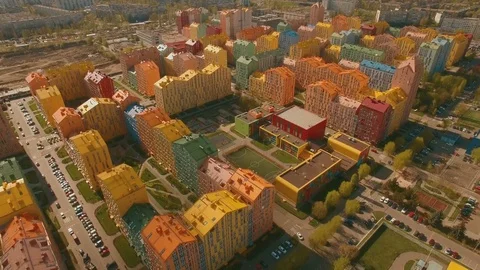 Flight over cozy comfortable colored houses in a European city 4K UHD aerial Stock Footage 75009610