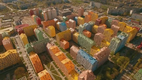 Flight over cozy comfortable colored houses in a European city 4K UHD aerial Stock Footage 75011958