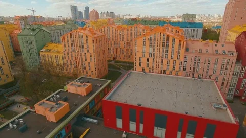 Flight over cozy comfortable colored houses in a European city 4K UHD aerial Stock Footage 75013407