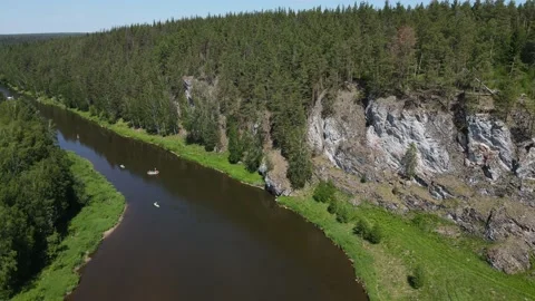 Flight over a dark river along the rocks Stock Footage 163377402