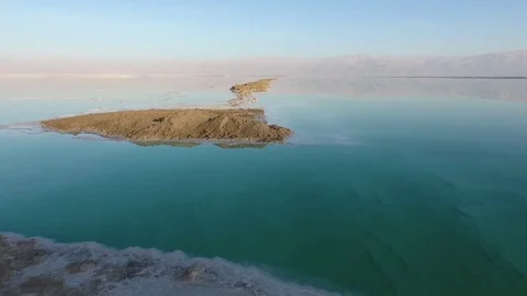 Flight over the dead sea. salt, water and dried shrubs. dead sea. Israel. Stockbeeldmateriaal 83859583