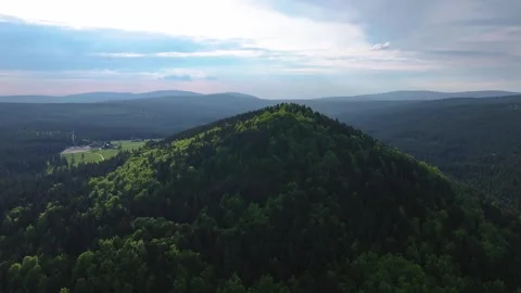 Flight over a dense forest in partly cloudy weather. Stock Footage 294388875
