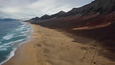 Flight over desert Cofete beach on Fuerteventura island, Spain 스톡 동영상 345735900