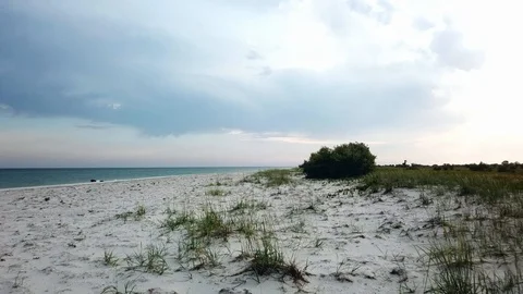 Flight over a deserted sandy beach by the sea 動画素材 120038969