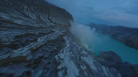 Flight over dried volcanic lava. Volcanic lake in indonesia. Stock Footage 237398144