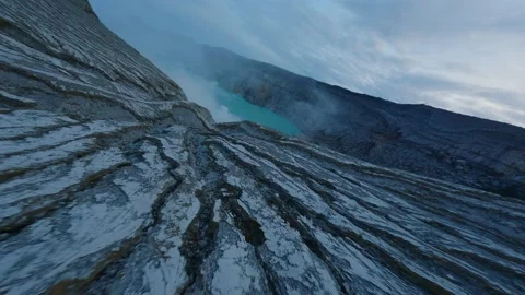 Flight over dried volcanic lava. Volcanic lake in indonesia. Stock Footage 237694110