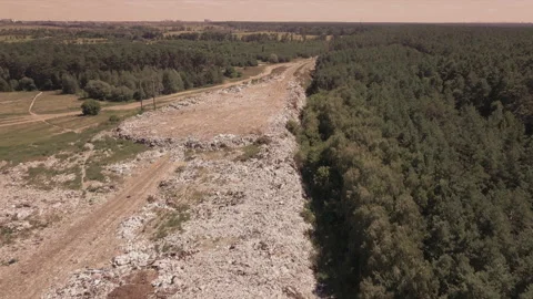 Flight over the dump around the forest, with mountains of household garbage Stock Footage 138090278