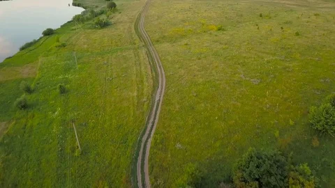 Flight over an empty road in the countryside Stock Footage 77909118
