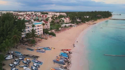 Flight over an empty tourist beach at a gentle sunrise in Punta Cana 스톡 동영상 306384906