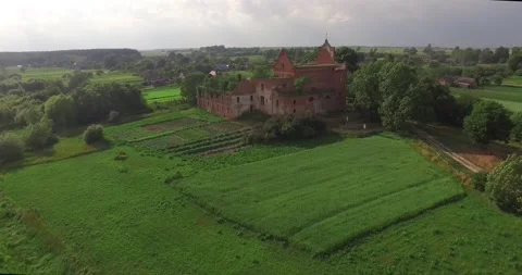 Flight over the field and the ancient temple Stock Footage 131226223