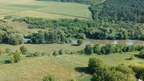 Flight over field and river Stock Footage 114082350