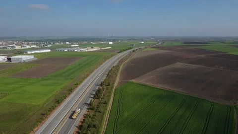 Flight over the field and road Stock Footage 171601783