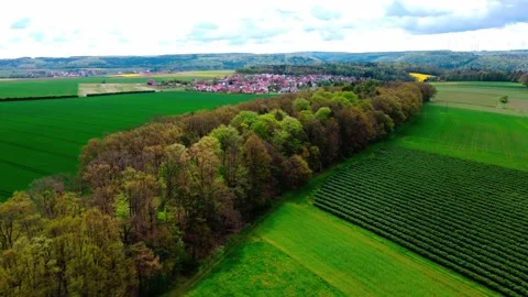Flight over the field to a small village Stock Footage 154371963